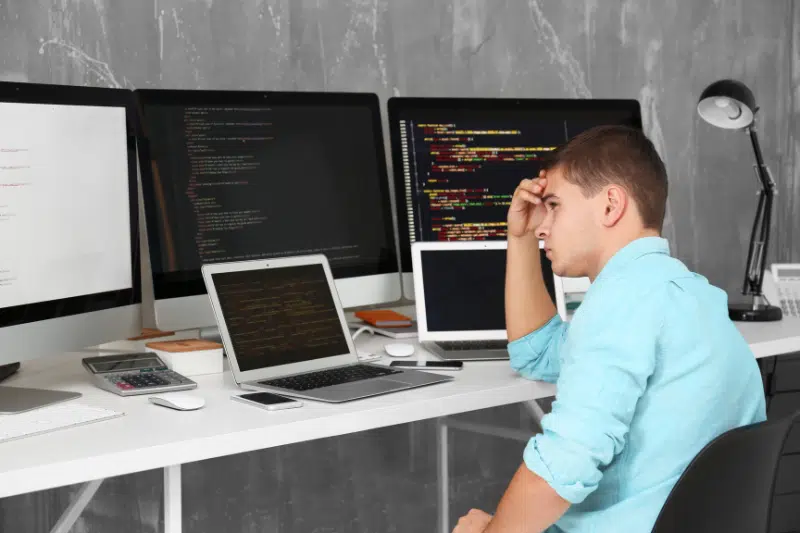 confused guy in front of monitors 800 X 533